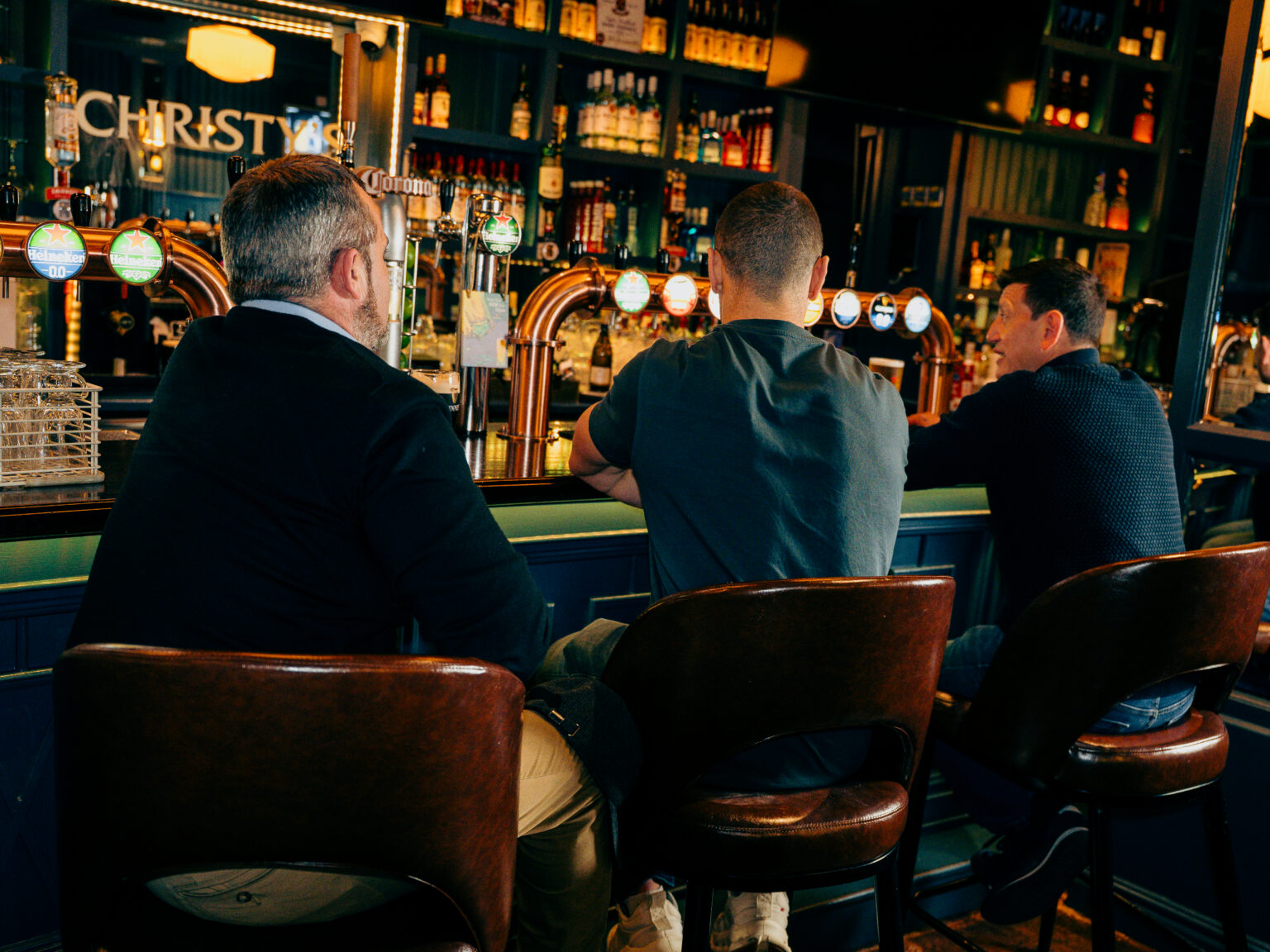 Guests at the bar watching the game at Gough's